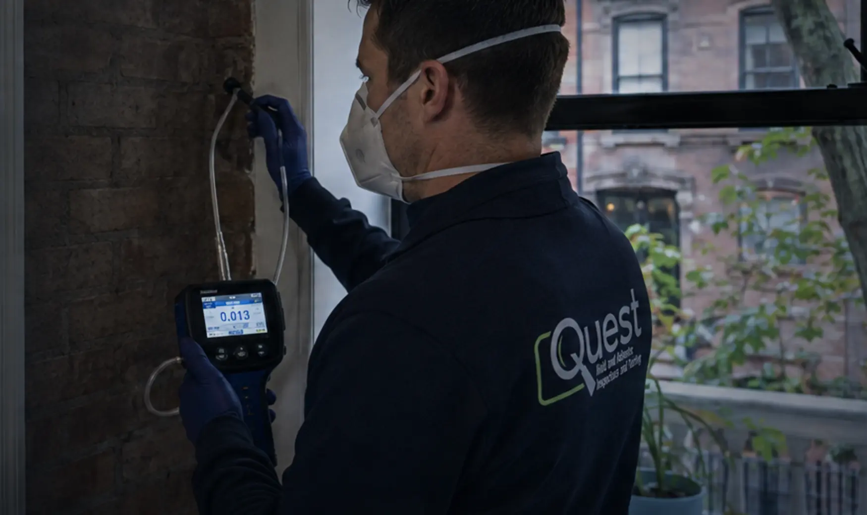 Quest environmental professional inspecting a New York property